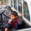 Young boy in the back of a pickup truck. Quito.